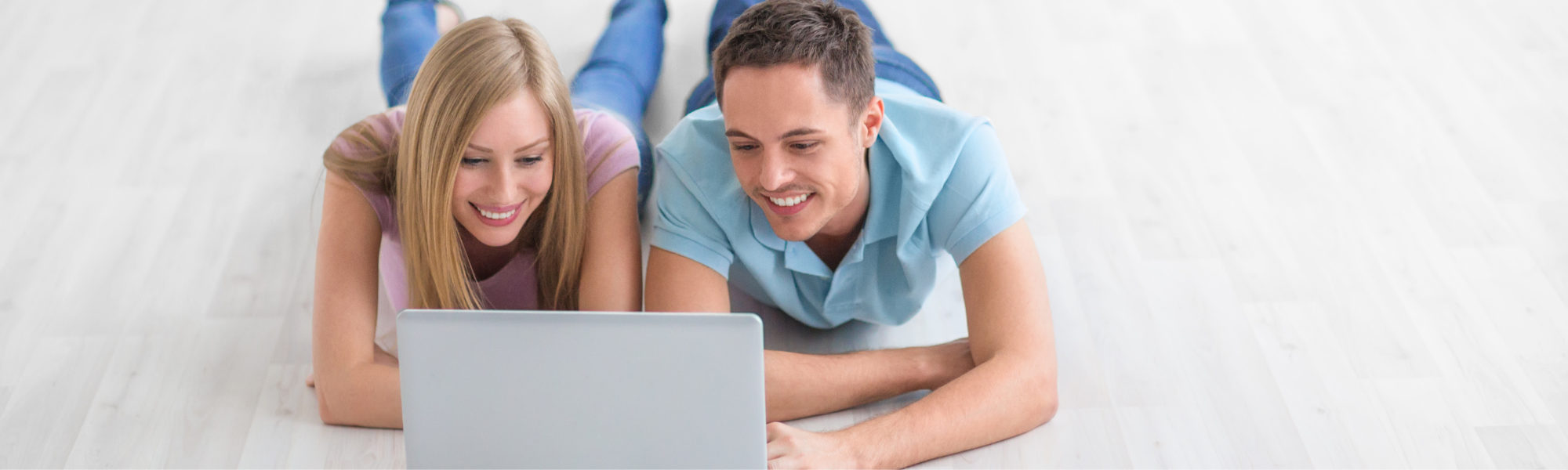 Couple reviewing insurance plans on a laptop 